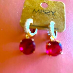 Pink stone and silver hearings .